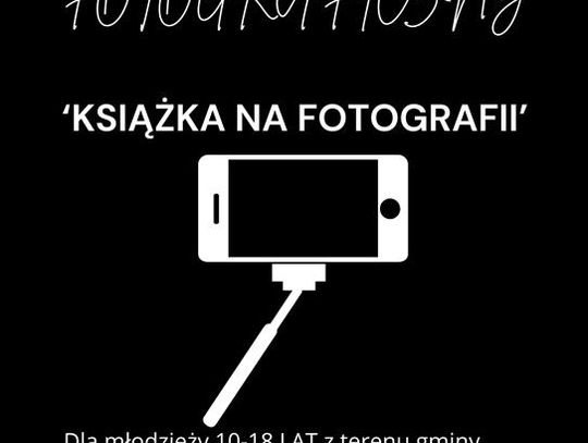 Plakat informuje o konkursie fotograficznym pn.: "Książka na fotografii", organizowanym przez Gminną Bibliotekę Publiczną w Fajsławicach